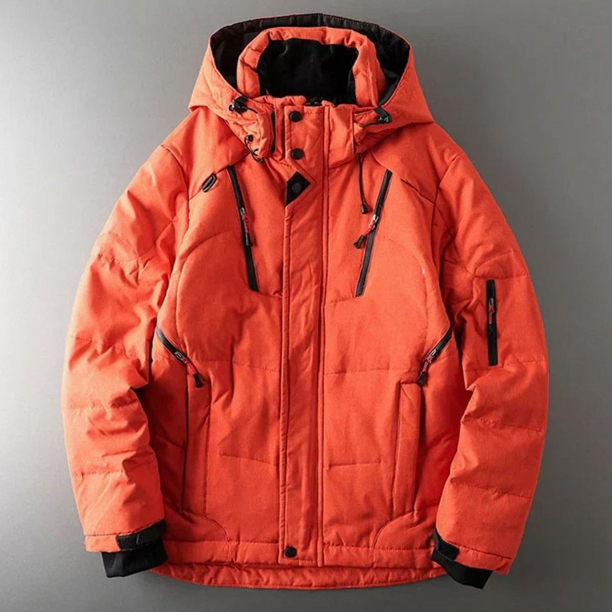 Men's Homixa insulated hooded puffer jacket with water-resistant fabric, zip pockets, and cozy lining for cold weather.