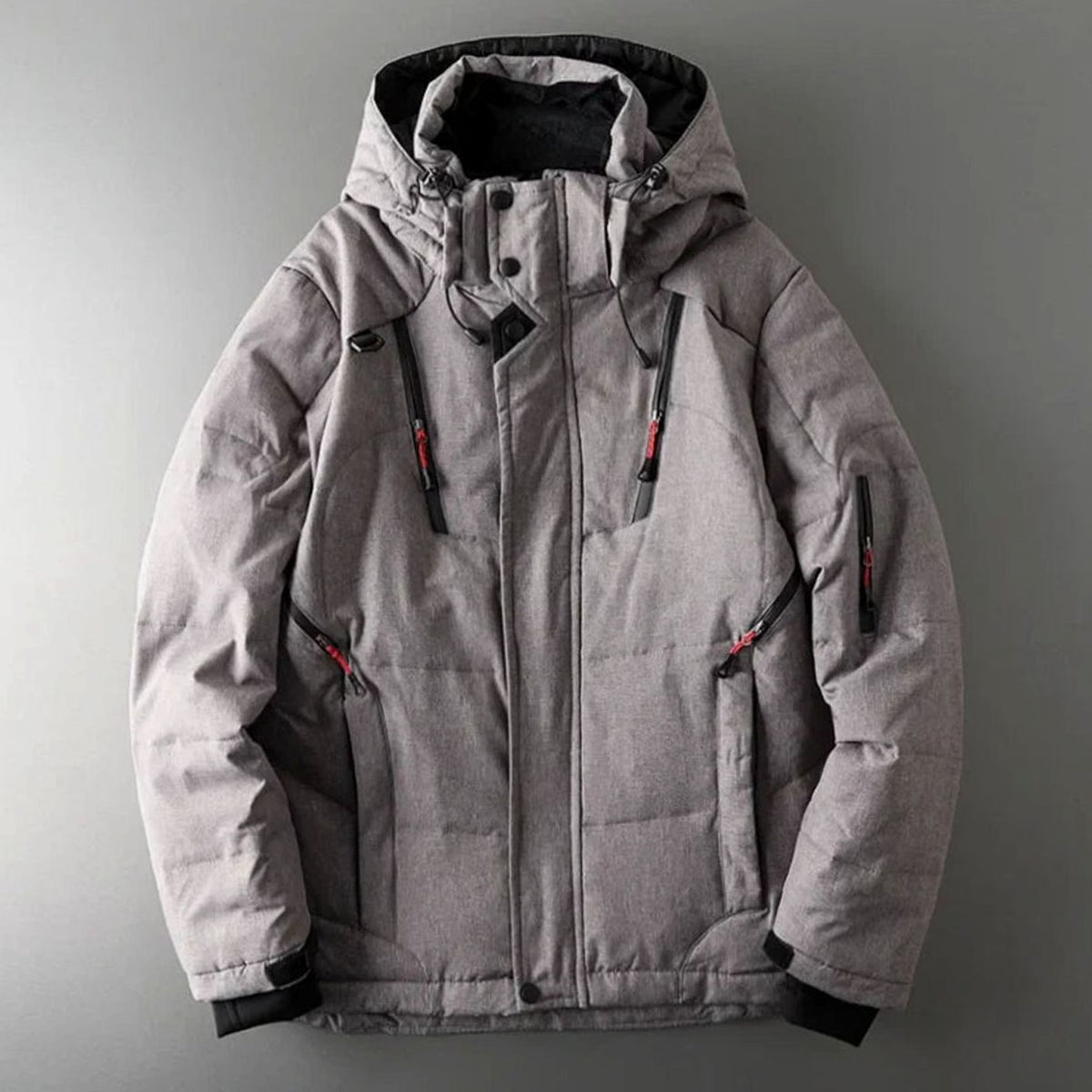 Men's Homixa insulated hooded water-resistant puffer jacket with zip pockets, showing the padded exterior and adjustable hood.