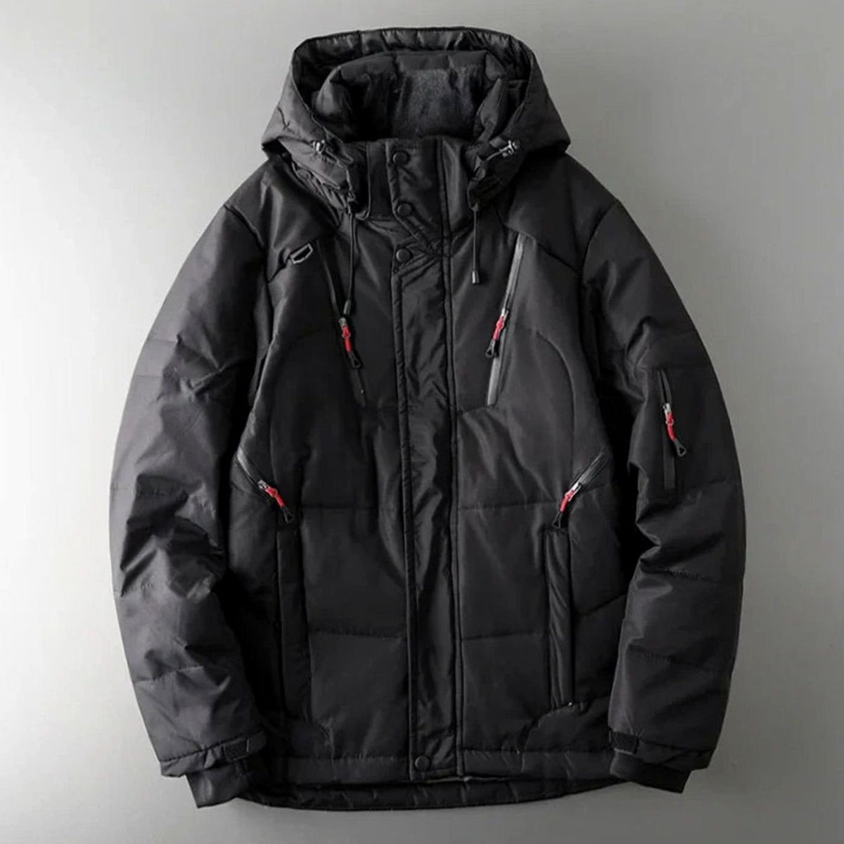 Men's Homixa insulated hooded water-resistant puffer jacket with zip pockets, showcasing its quilted design and warm lining.