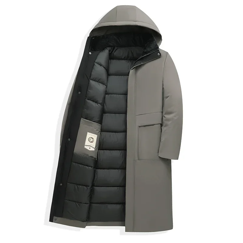 Men's Homixa long puffer coat with quilted lining and adjustable drawstring hood, designed for warmth and comfort.
