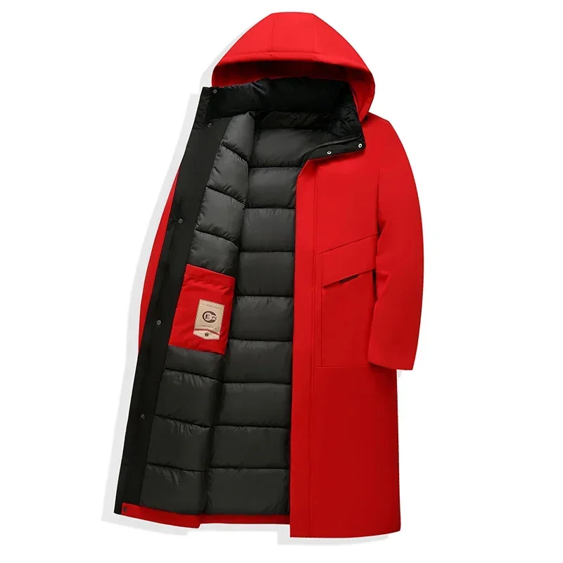 Men's long puffer coat by Homixa with quilted lining and adjustable drawstring hood, designed for warmth and style.