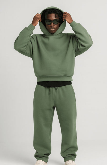 Men's oversized fleece tracksuit set by Homixa featuring a drawstring hoodie and elastic-waist joggers in soft fleece fabric.