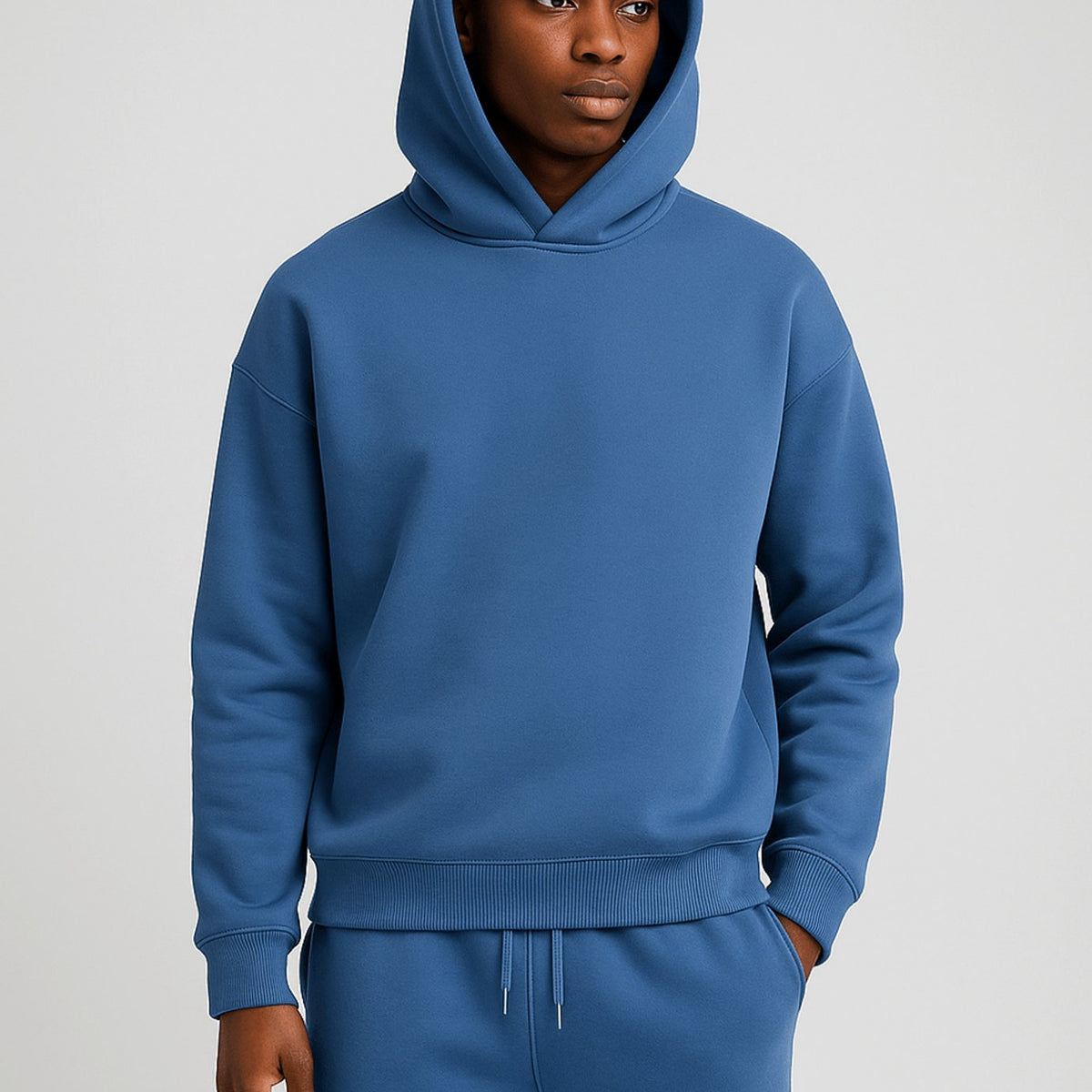 Men's oversized hoodie and jogger tracksuit set by Homixa with drawstring hood and elastic waist, casual athletic loungewear.