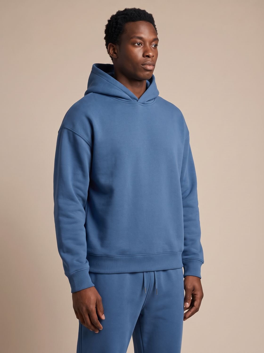 Men's oversized Homixa track suit with drawstring hoodie and elastic-waist joggers, casual athletic apparel for comfortable fit.