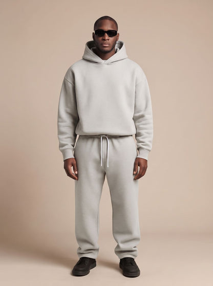 Men's oversized Homixa track suit with drawstring hoodie and elastic-waist joggers, featuring comfortable, casual athletic style.