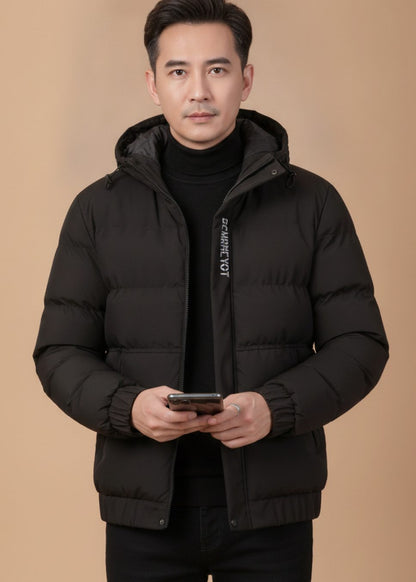 Men's relaxed-fit quilted winter jacket by Homixa with drawstring hood and padded interior, suitable for cold weather.