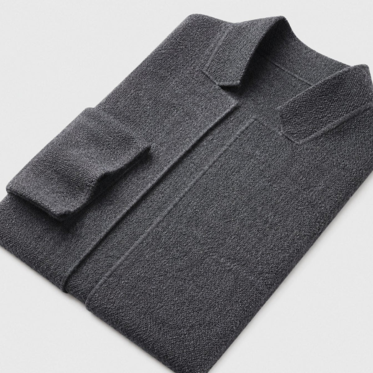 Men's slim-fit knit cardigan by Homixa featuring a button-up front, chest and lower patch pockets, in a sleek, fitted style.
