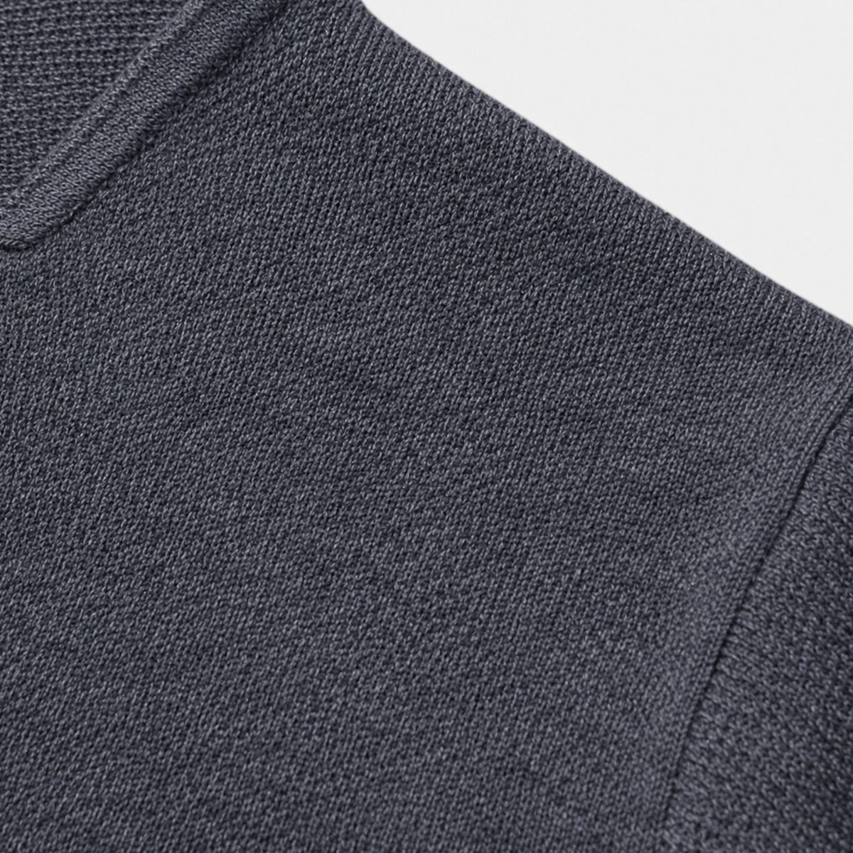 Men's slim-fit knit button-up cardigan by Homixa with chest and lower patch pockets, featuring a sleek, fitted design.