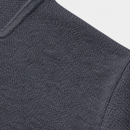 Men's slim-fit knit button-up cardigan by Homixa with chest and lower patch pockets, featuring a sleek, fitted design.