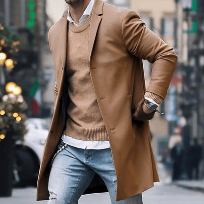 Men's tailored long overcoat with notched lapel and button-front closure, stylish Homixa men's outerwear.