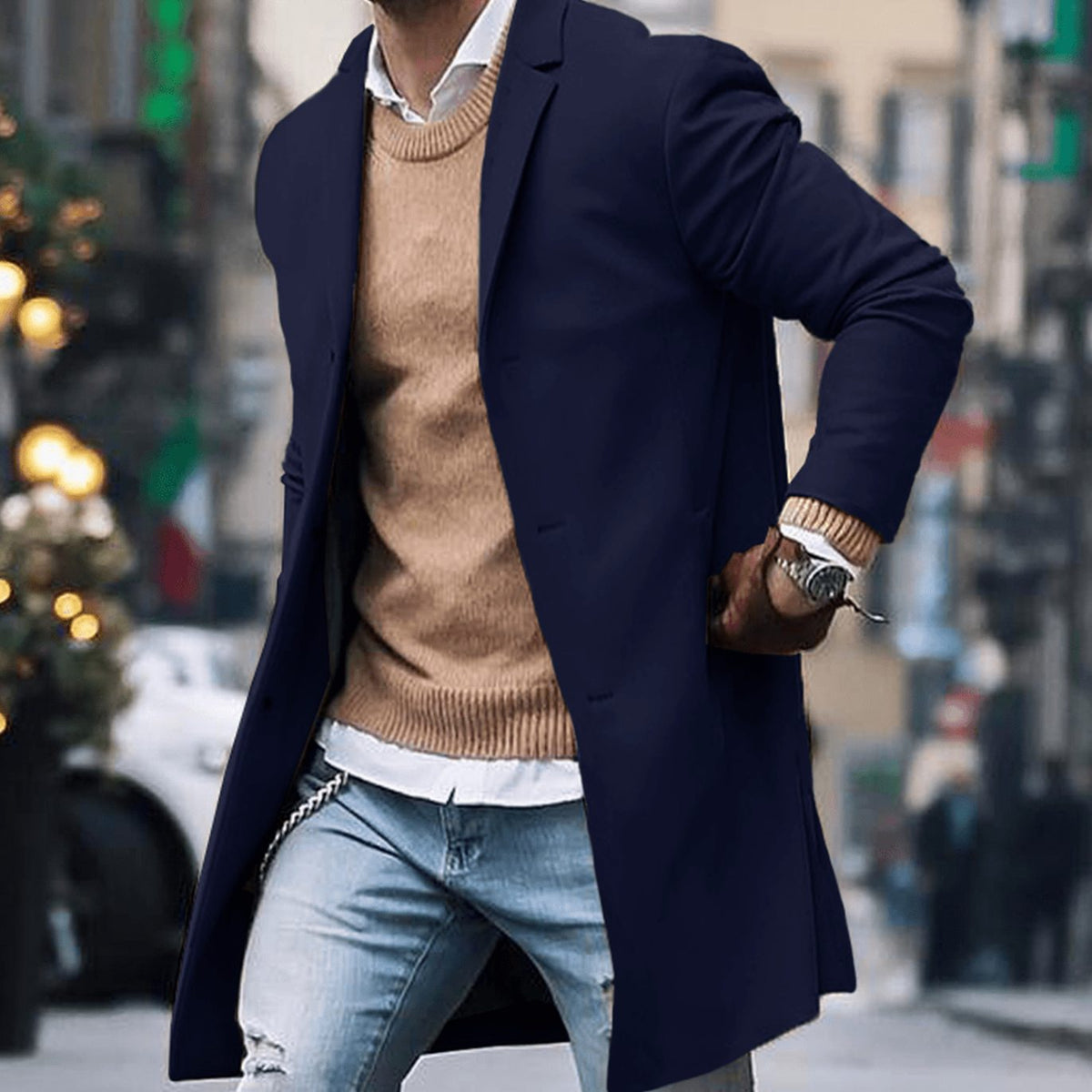Men's tailored long overcoat by Homixa with notched lapel and button-front closure, displayed on a mannequin.