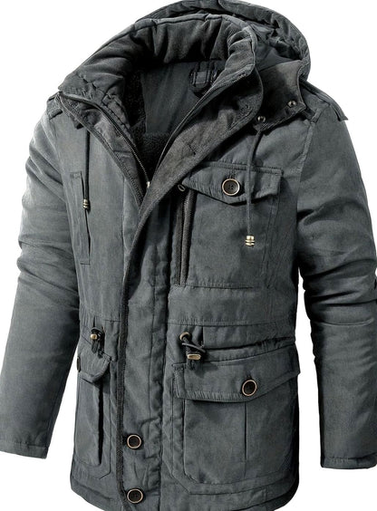 Men's Homixa utility jacket with adjustable hood, insulated padding, and cargo pockets, designed for outdoor wear and warmth.