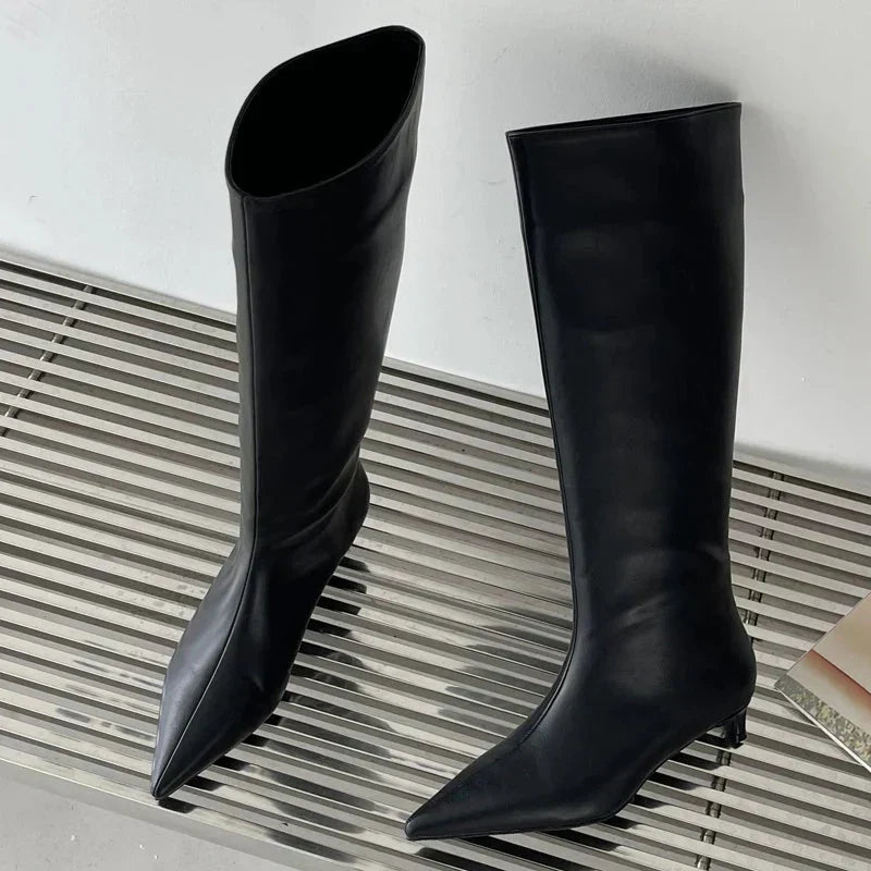 Black Homixa knee high boots for men with sleek design and sturdy soles, perfect for everyday footwear.