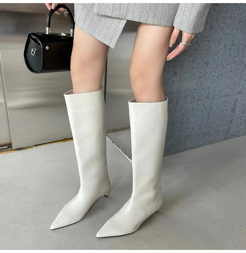 Black Homixa knee-high boots for men, stylish and durable footwear with a sleek design and pointed toe.