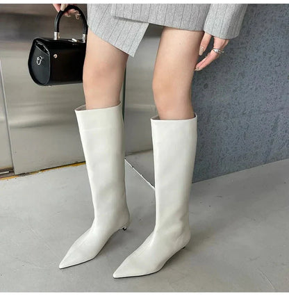 Black Homixa knee-high boots for men, stylish and durable footwear with a sleek design and pointed toe.
