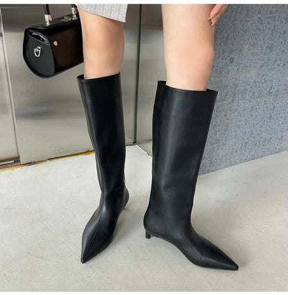 Black Homixa knee high boots for men, stylish and versatile footwear with a sleek design and sturdy sole.
