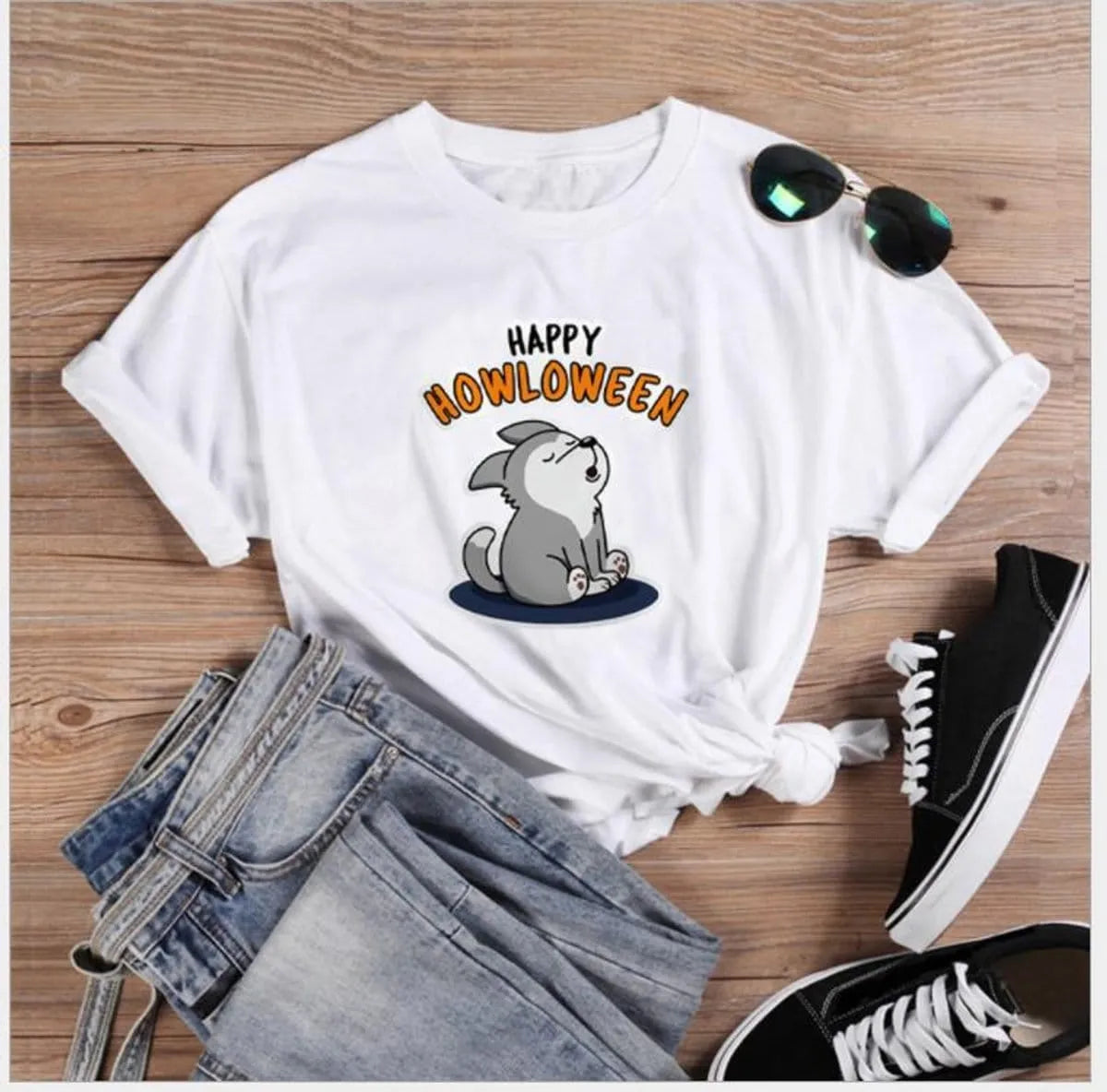 Women's Halloween T-Shirt by Homixa featuring a fun Happy Howloween graphic on a cotton Halloween T-shirt.