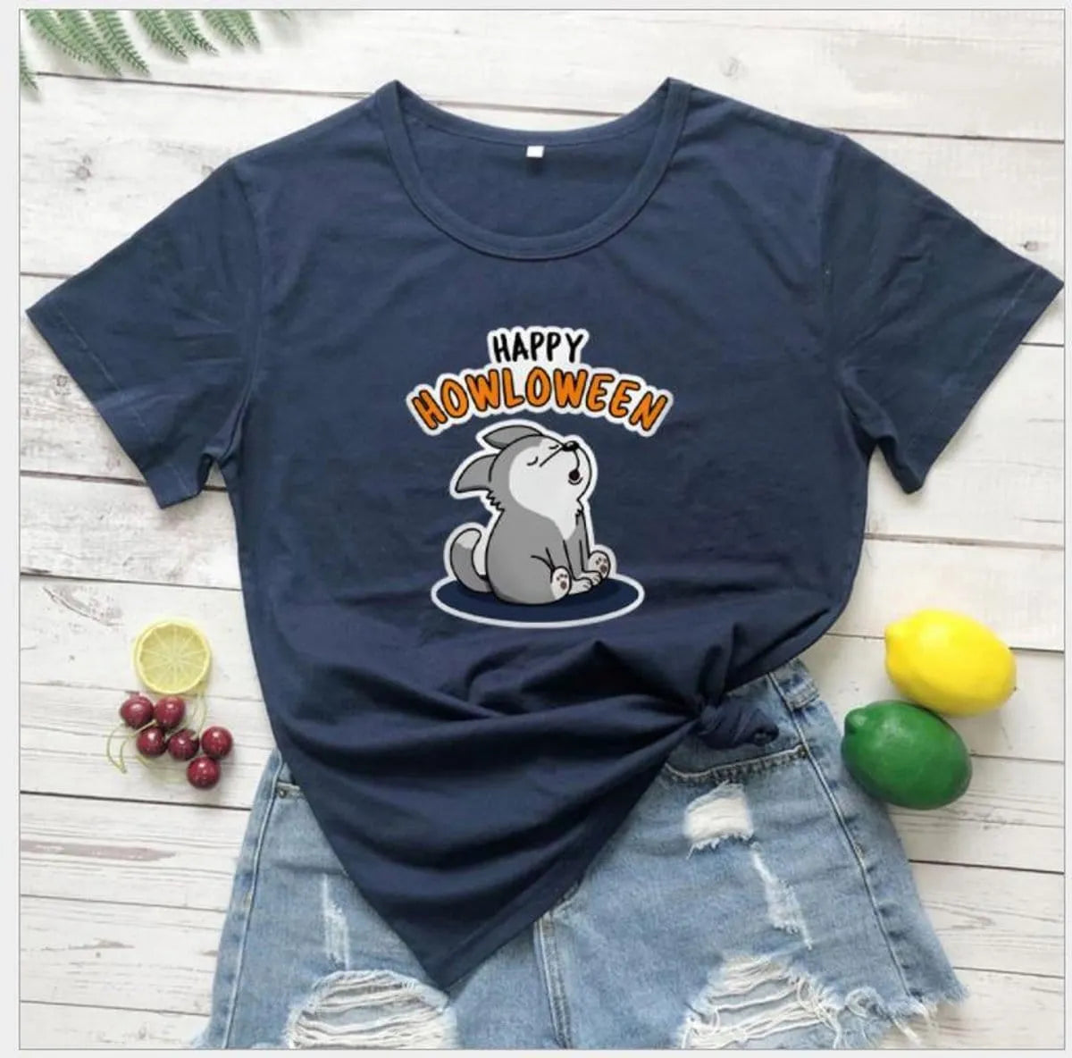 Women's Halloween T-Shirt by Homixa featuring a playful Happy Howloween graphic on a cotton fabric.