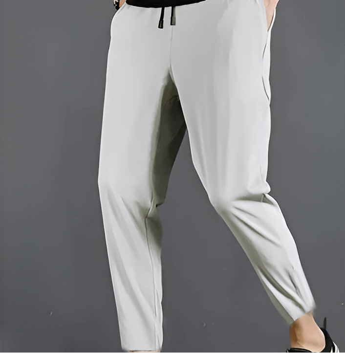 Homixa men's quick-dry stretch hiking trousers with tapered legs, drawstring waist, and zip pockets, ideal for outdoor activities.