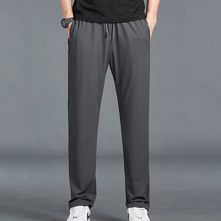 Men's Homixa quick-dry stretch hiking trousers with tapered legs, drawstring waist, and zip pockets, suitable for outdoor adventures.