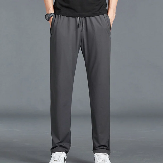 Men's Homixa quick-dry stretch hiking trousers with tapered legs, drawstring waist, and zip pockets, suitable for outdoor adventures.