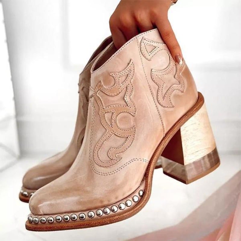 Homixa women's cowboy boots with relaxed fit, featuring classic Western style and leather detailing in a natural stance.