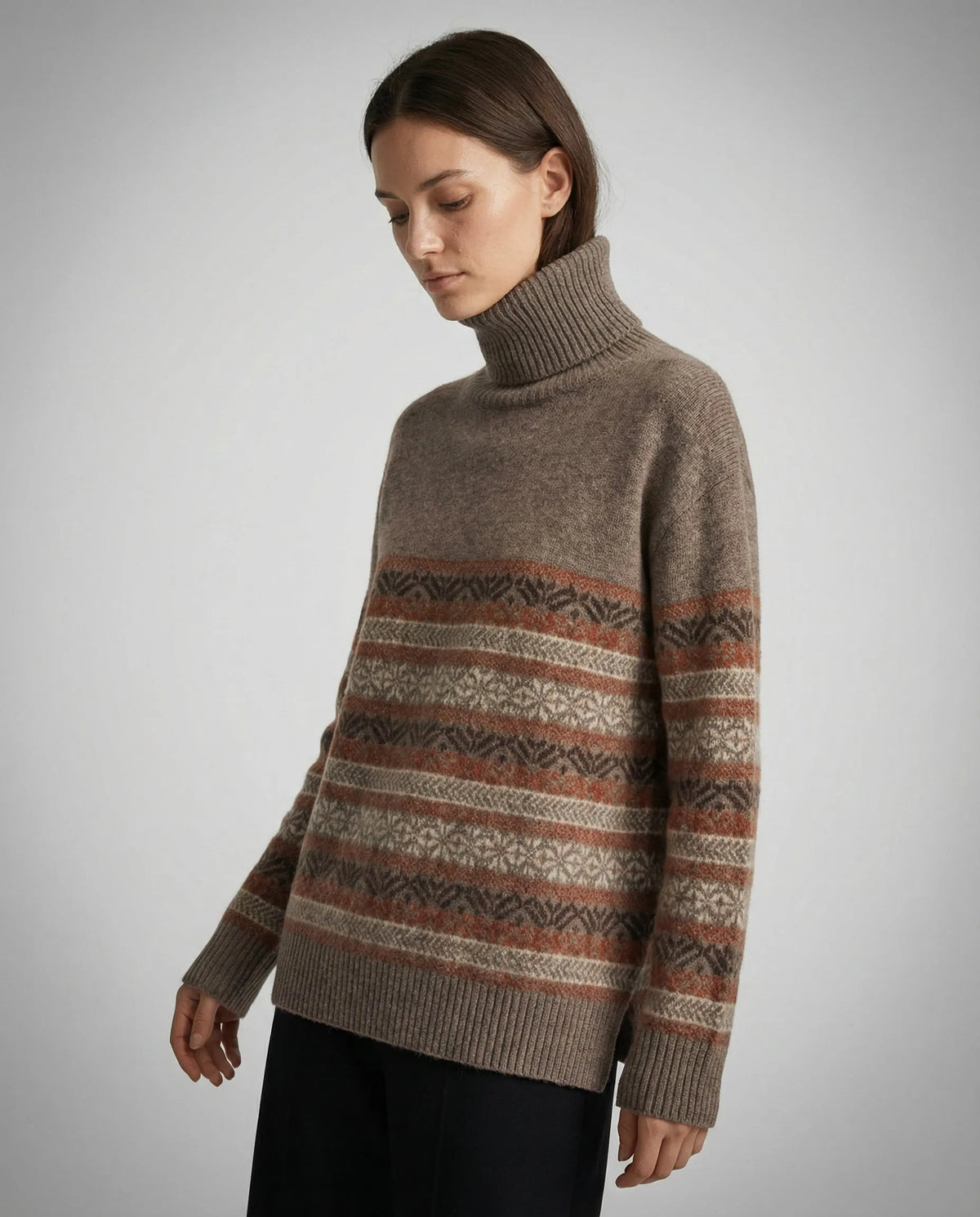 Homixa Lily women's fair-isle turtleneck sweater with patterned sleeves and ribbed cuffs, shown in a close-up image.