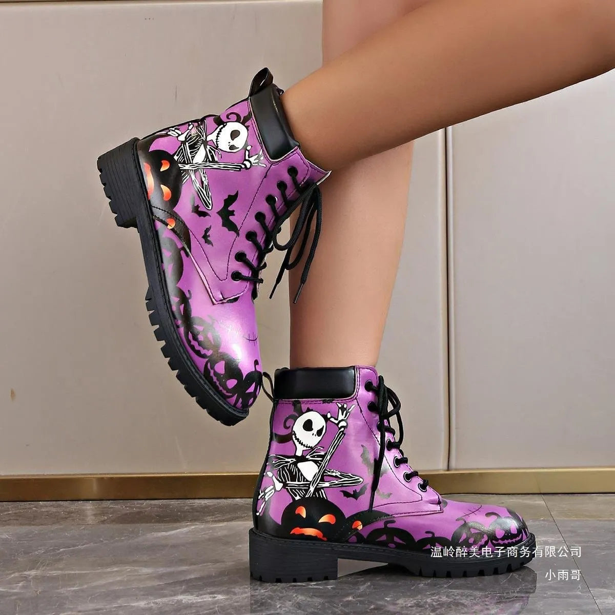 Women's Halloween combat boots by Homixa featuring skeleton, pumpkin, and bat lace-up design with spooky themed details.