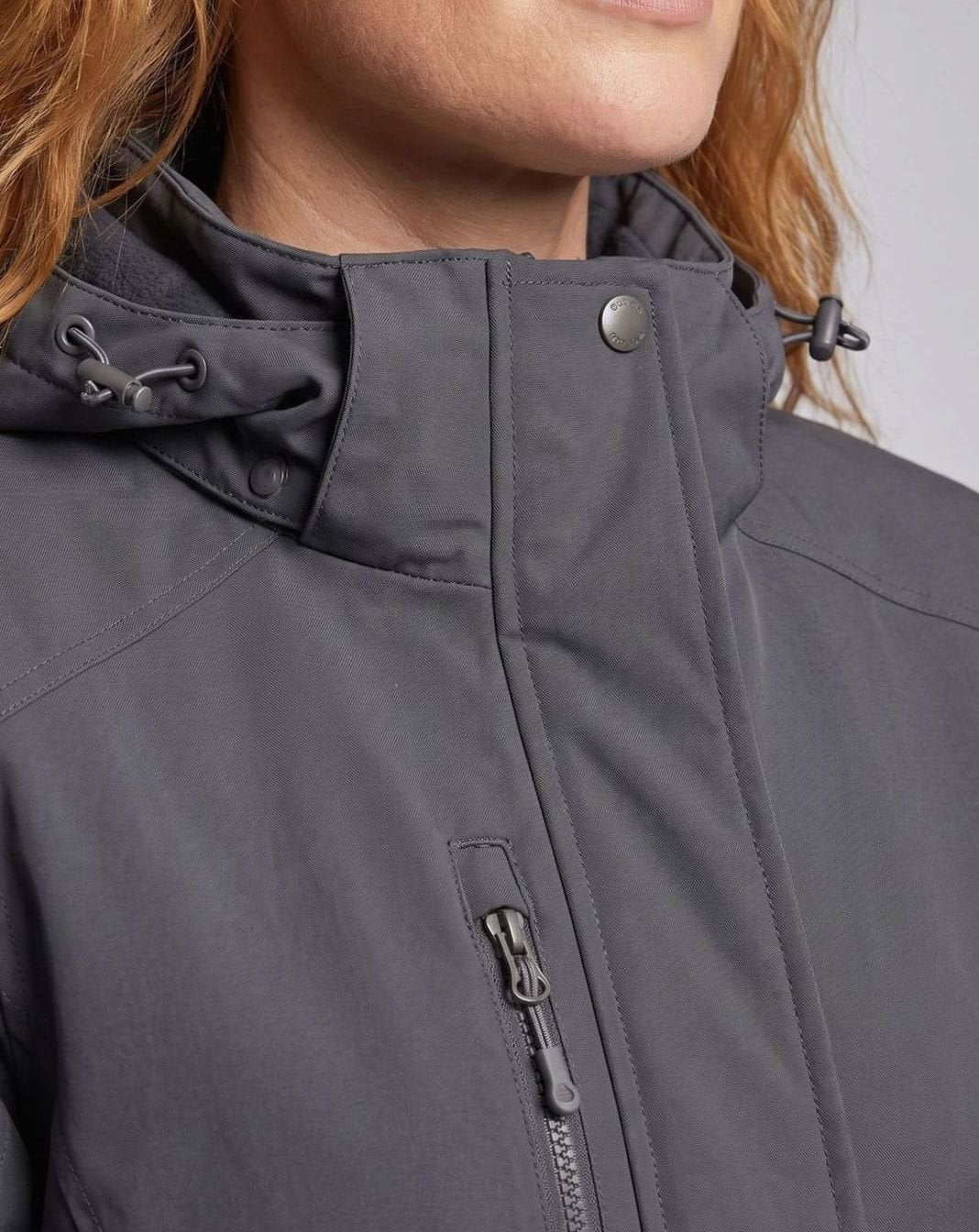 Homixa water-resistant hooded winter jacket with zip pockets and adjustable cuffs, ideal for cold, wet weather.