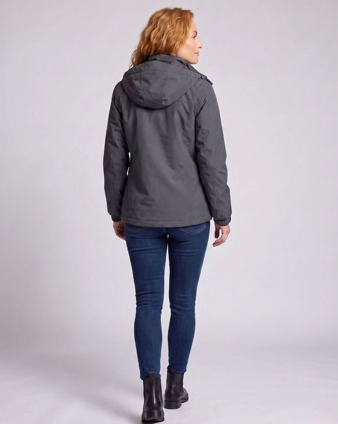 Homixa water-resistant hooded winter jacket with zip pockets and adjustable cuffs, perfect for cold, wet weather.
