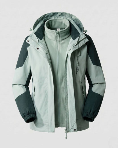 Homixa waterproof two-layer hooded outdoor jacket with adjustable hem and cuffs, shown on a hanger in a bright outdoor setting.