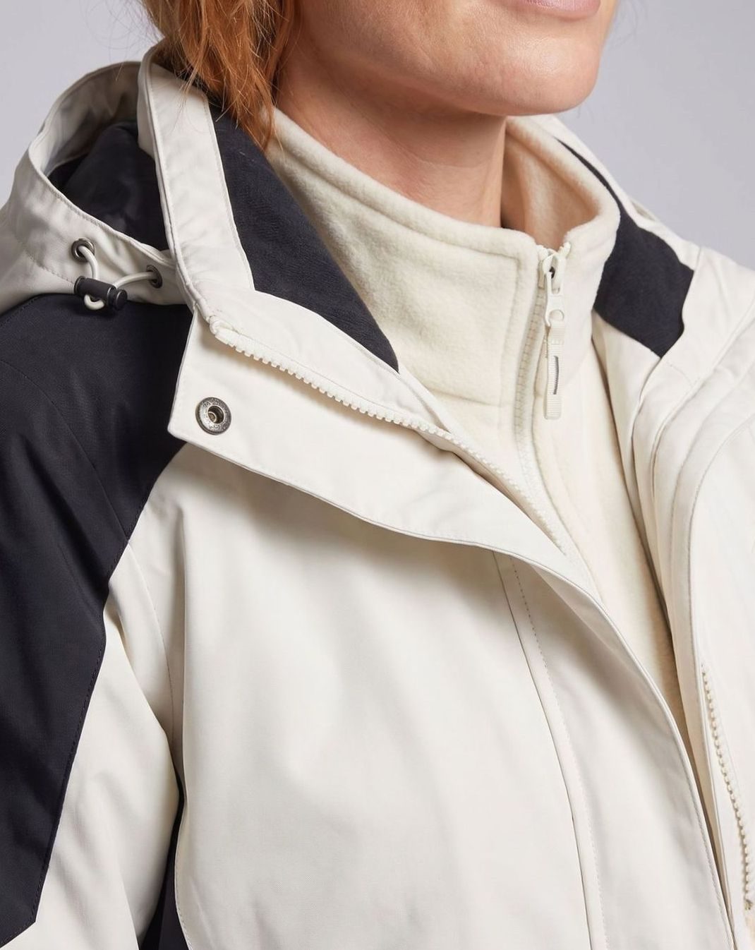 Homixa waterproof two-layer hooded outdoor jacket with adjustable hem and cuffs, shown with front zipper and hood.