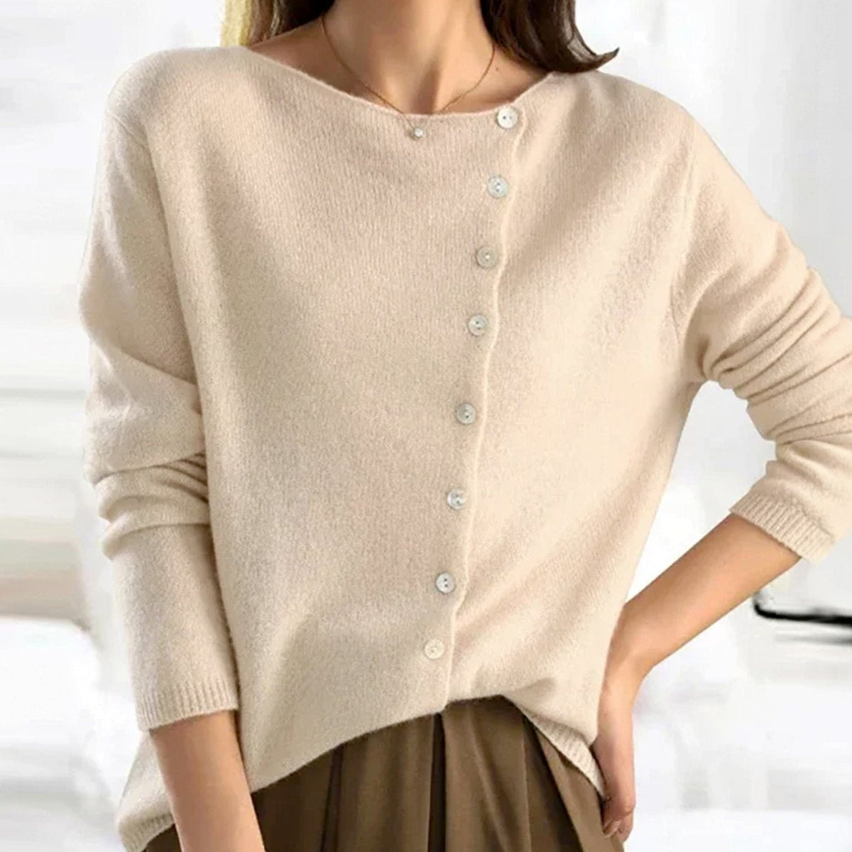 Women's asymmetric V-neck cardigan by Homixa featuring soft knit fabric and pearl-tone button details.