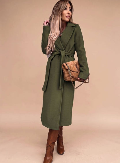 Women's belted knee-length trench coat by Homixa with notched lapels and wool-blend fabric, styled with a belt and classic silhouette.