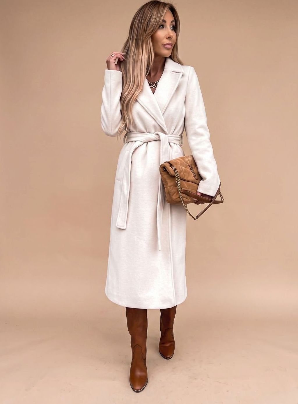 Women's belted knee-length trench coat by Homixa with notched lapels and wool-blend fabric, shown on a model.