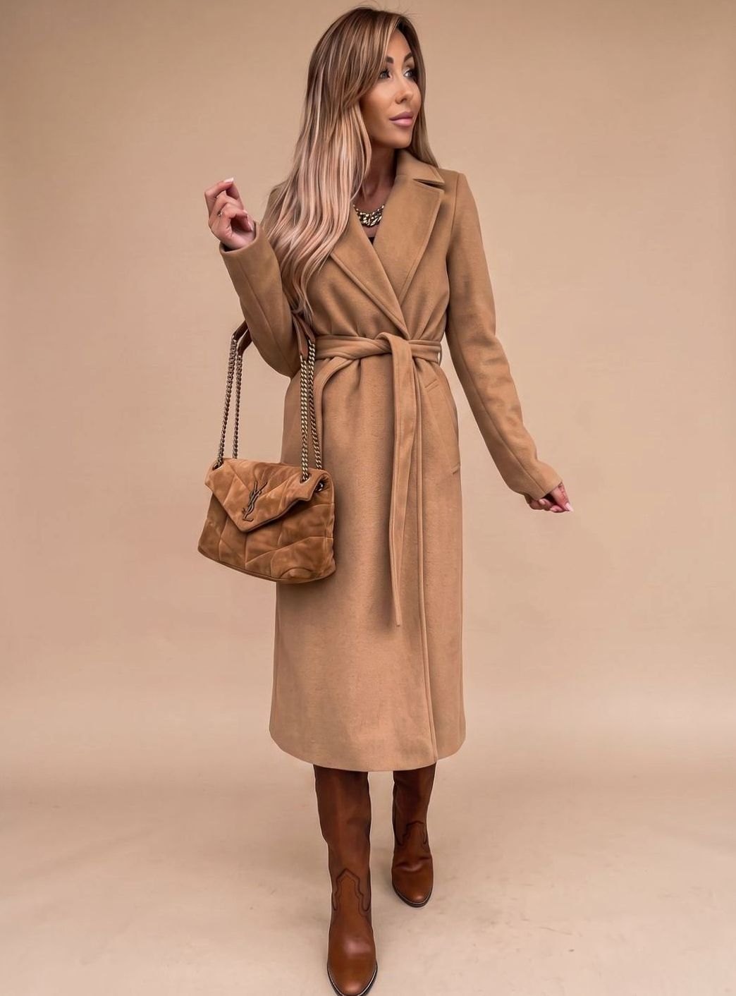 Women’s belted knee-length trench coat with notched lapels and wool-blend fabric, featuring a waist belt and classic style.