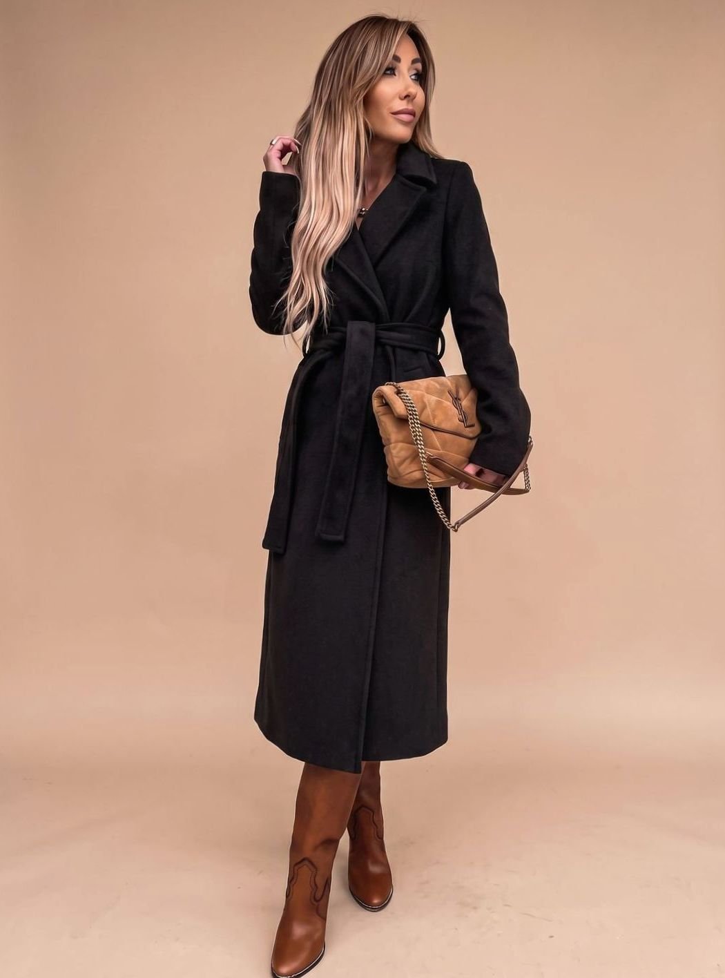 Women's belted knee-length trench coat by Homixa with notched lapels and wool-blend fabric, shown on a model.