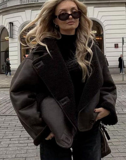 Women's faux suede biker jacket by Homixa with sherpa collar and button front, shown on a model.