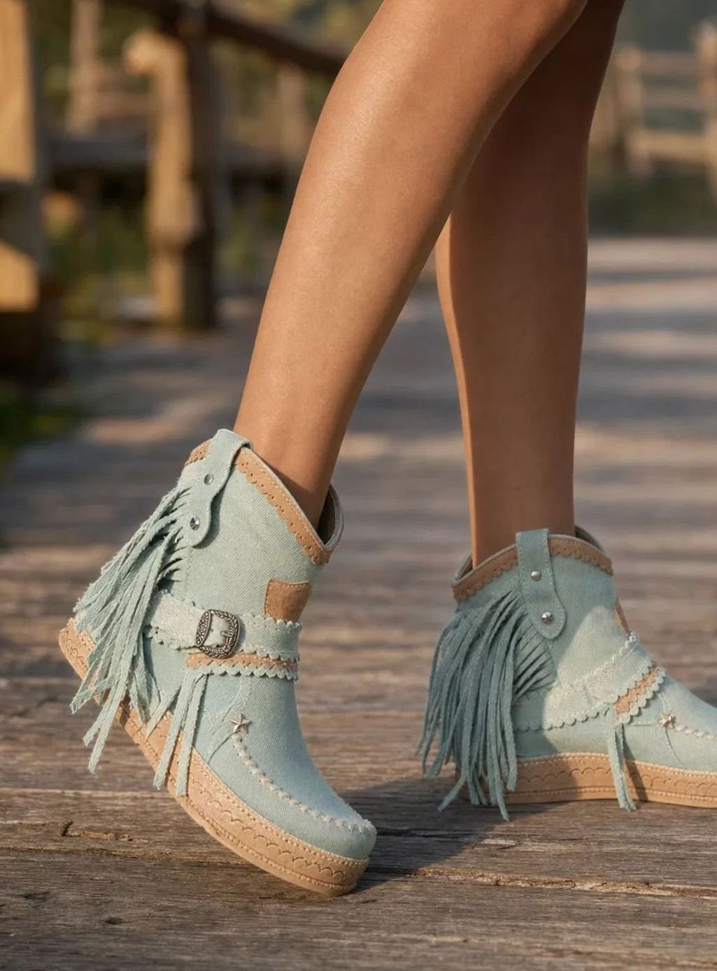 Women's boho Western boots by Homixa featuring fringe, buckle accents, and decorative stitching, styled with a western-inspired design.