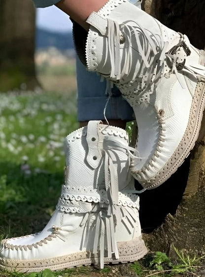 Homixa women's boho western boots with fringe, buckle accents, and decorative stitching showcasing a stylish Western footwear design.