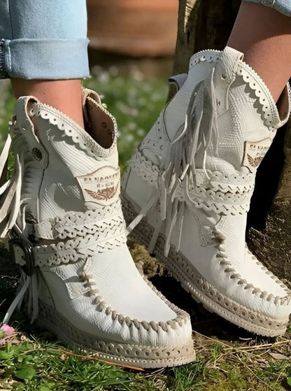 Women's boho western boots by Homixa featuring fringe, buckle details, and decorative stitching, styled for casual western wear.