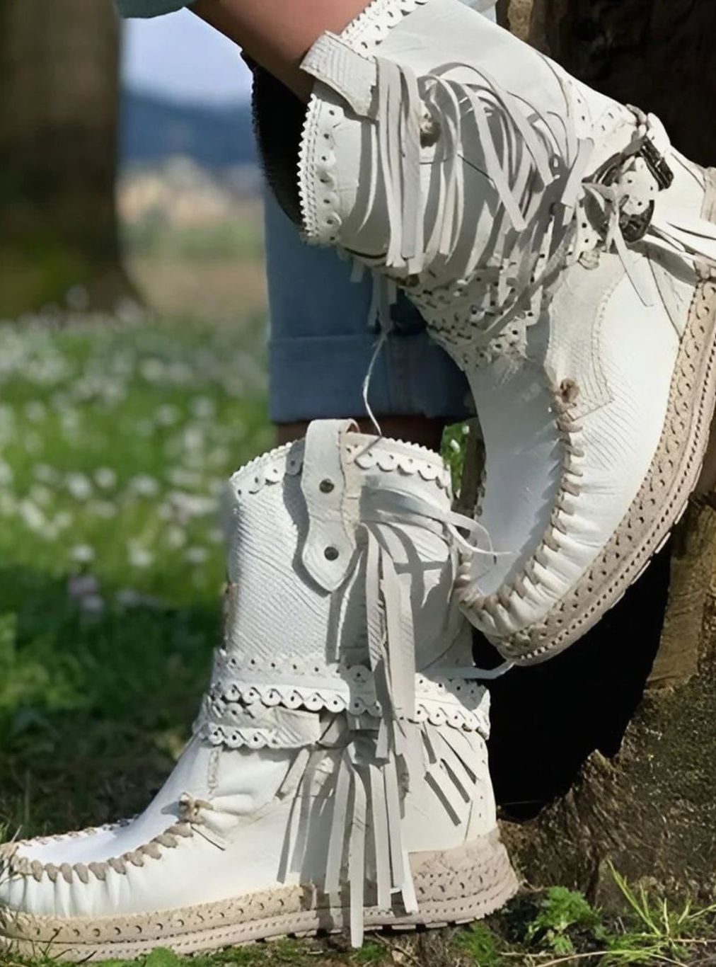 Women's boho Western boots by Homixa with fringe, buckle accents, and decorative stitching, showcasing stylish Western footwear.