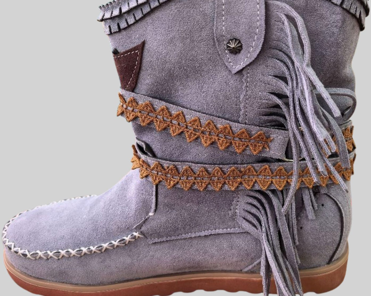 Women's boho Western boots by Homixa featuring fringe, buckle accents, and decorative stitching for a stylish Western look.