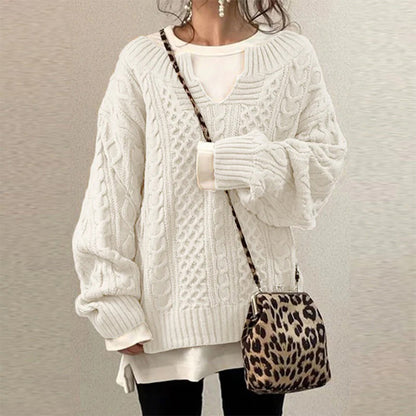 Women's cable-knit sweater by Homixa featuring a notched neckline and wide ribbed cuffs, styled for a cozy and fashionable look.