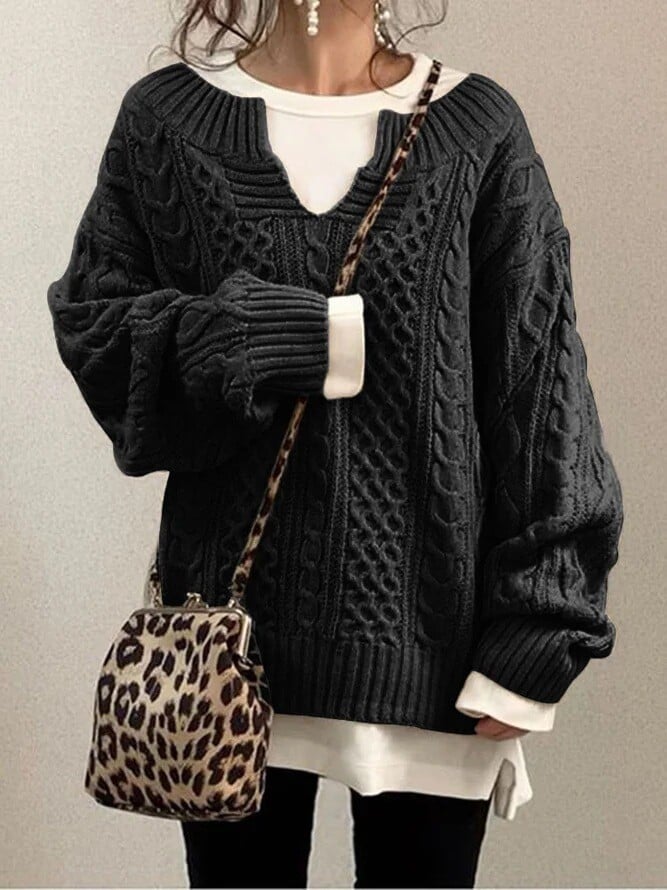 Women’s cable-knit sweater by Homixa featuring a notched neckline and wide ribbed cuffs, styled for a cozy, fashionable look.