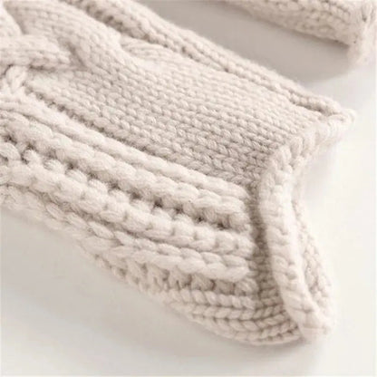 Women's cable-knit turtleneck sweater by Homixa featuring openwork detail and ribbed cuffs, styled for a cozy, fashionable look.
