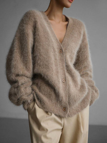 Women's oversized cashmere cardigan by Tessa's Shop with button-up front and relaxed fit, shown in a cozy, neutral color.