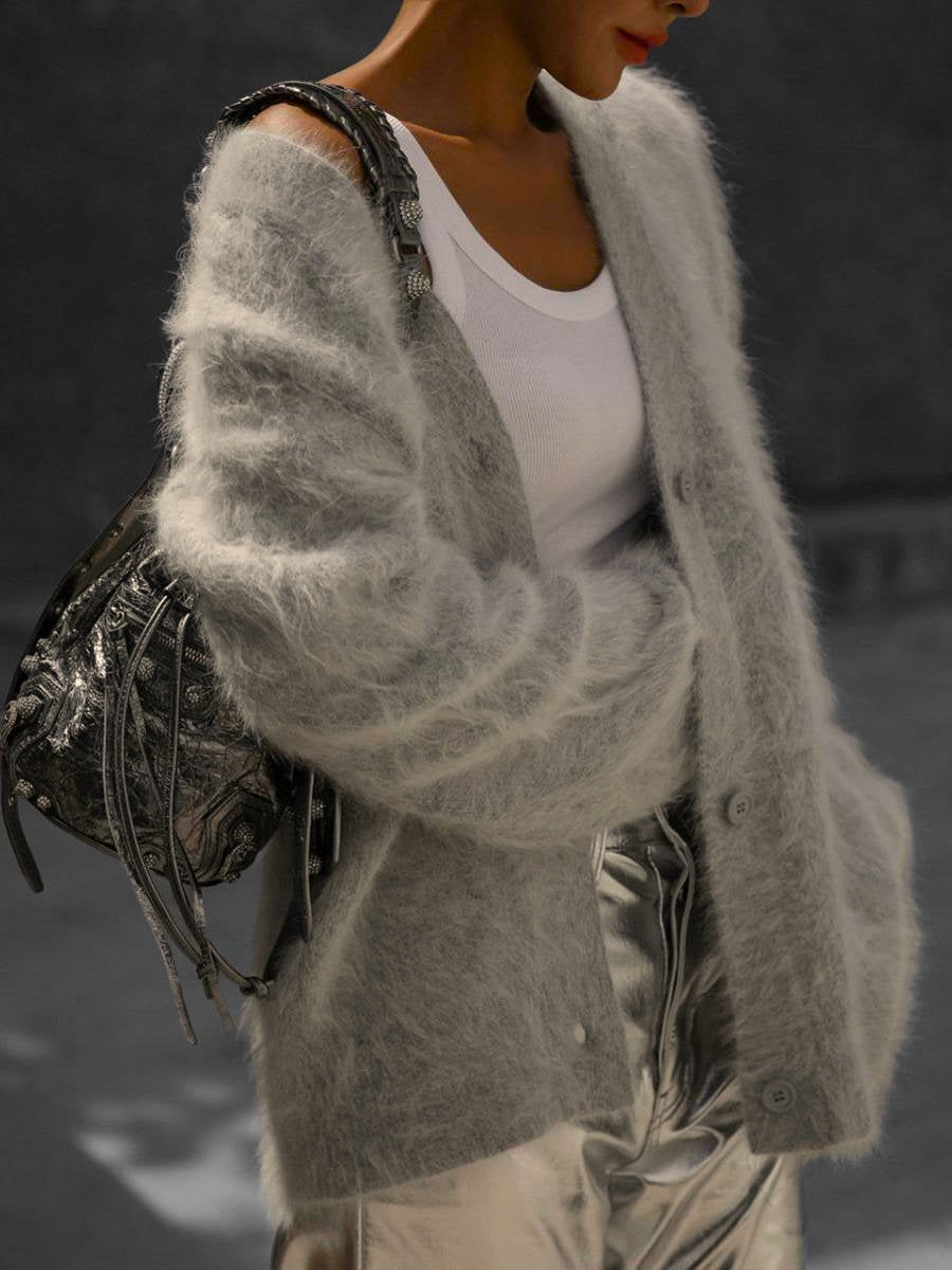 Soft beige Tessa's Shop Grace cashmere oversized cardigan with button-up front worn by a woman in a casual setting.