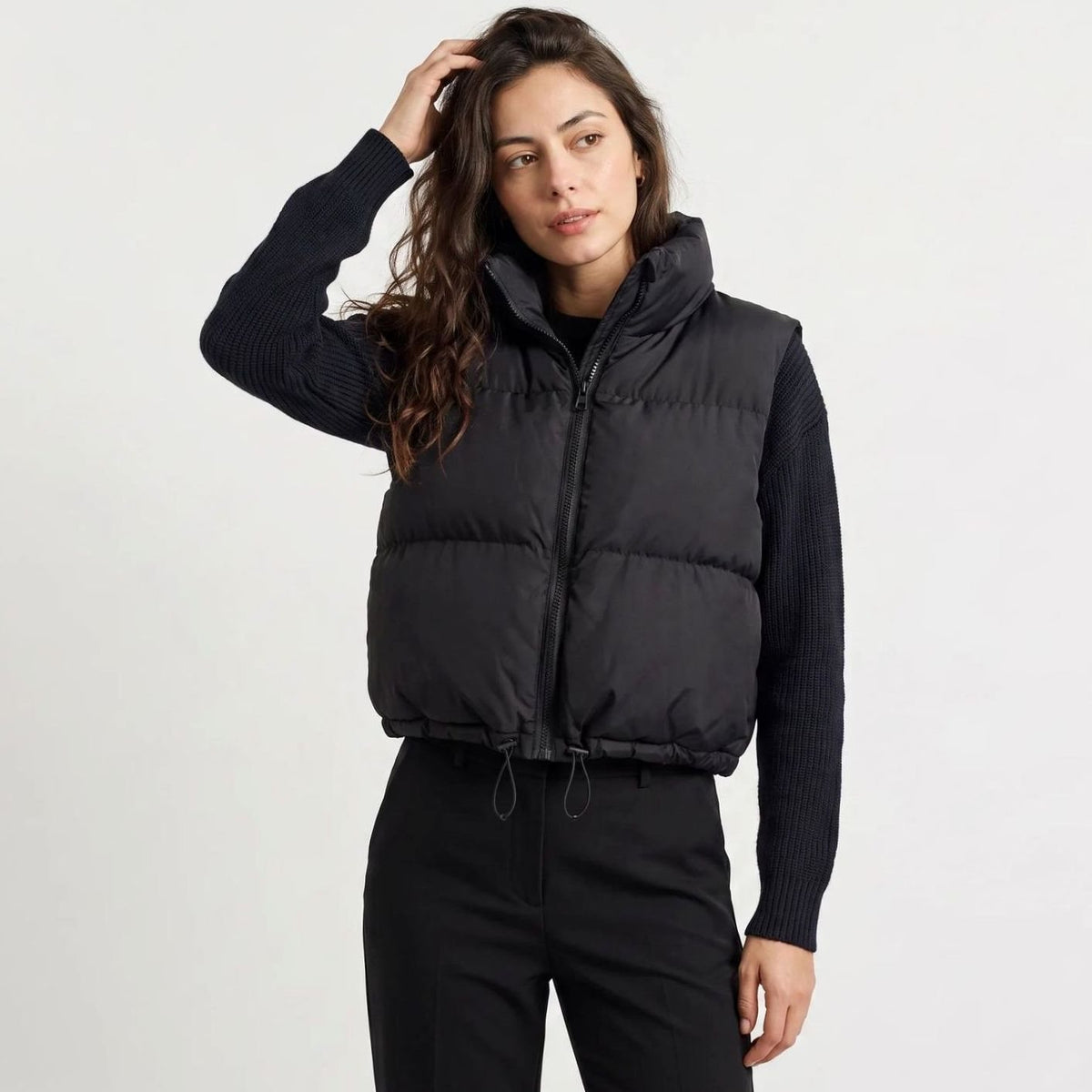 Homixa women's casual cropped quilted sleeveless puffer vest with high collar and zip front, designed for stylish comfort.