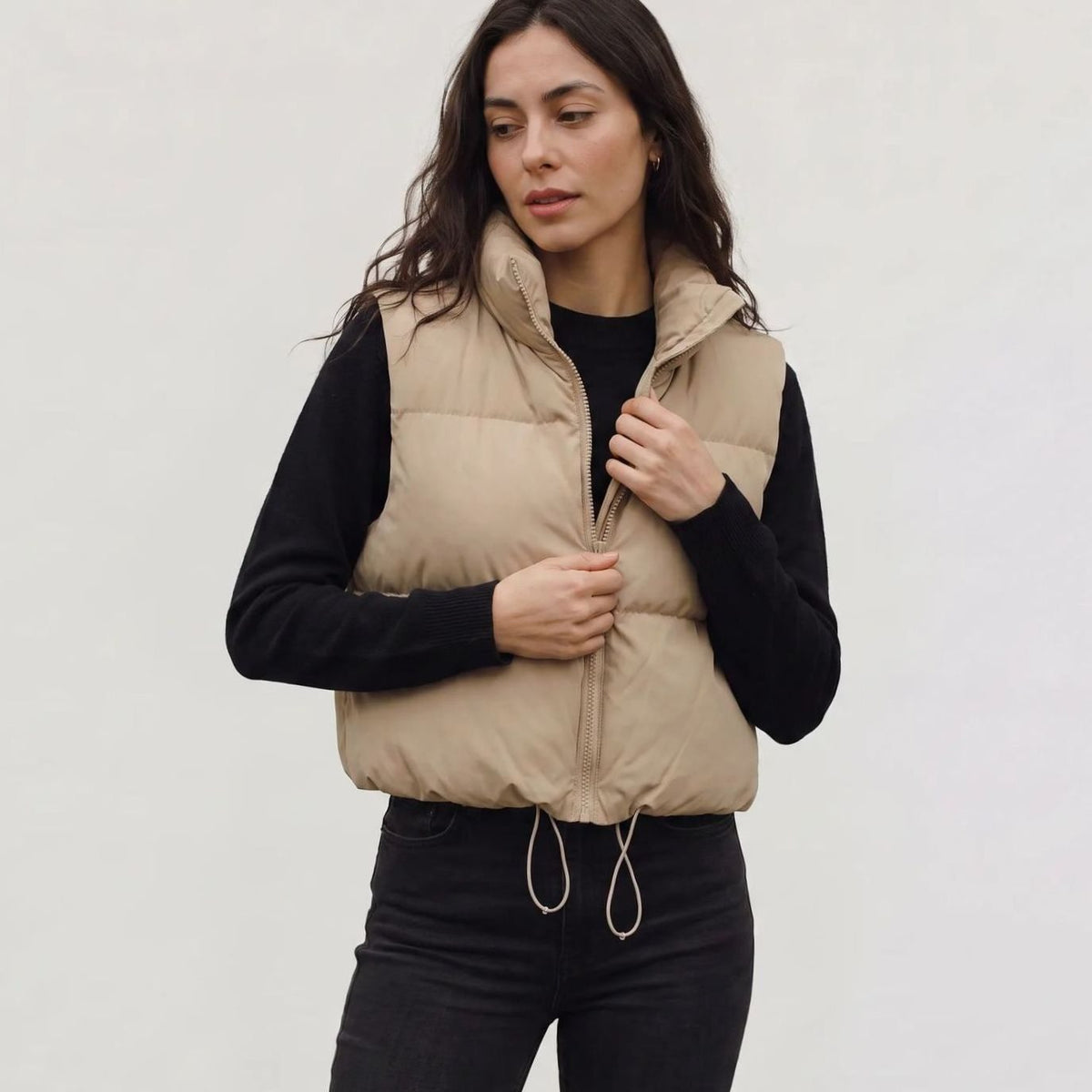 Women's casual cropped quilted puffer vest by Homixa featuring sleeveless design, high collar, and zip-front closure.